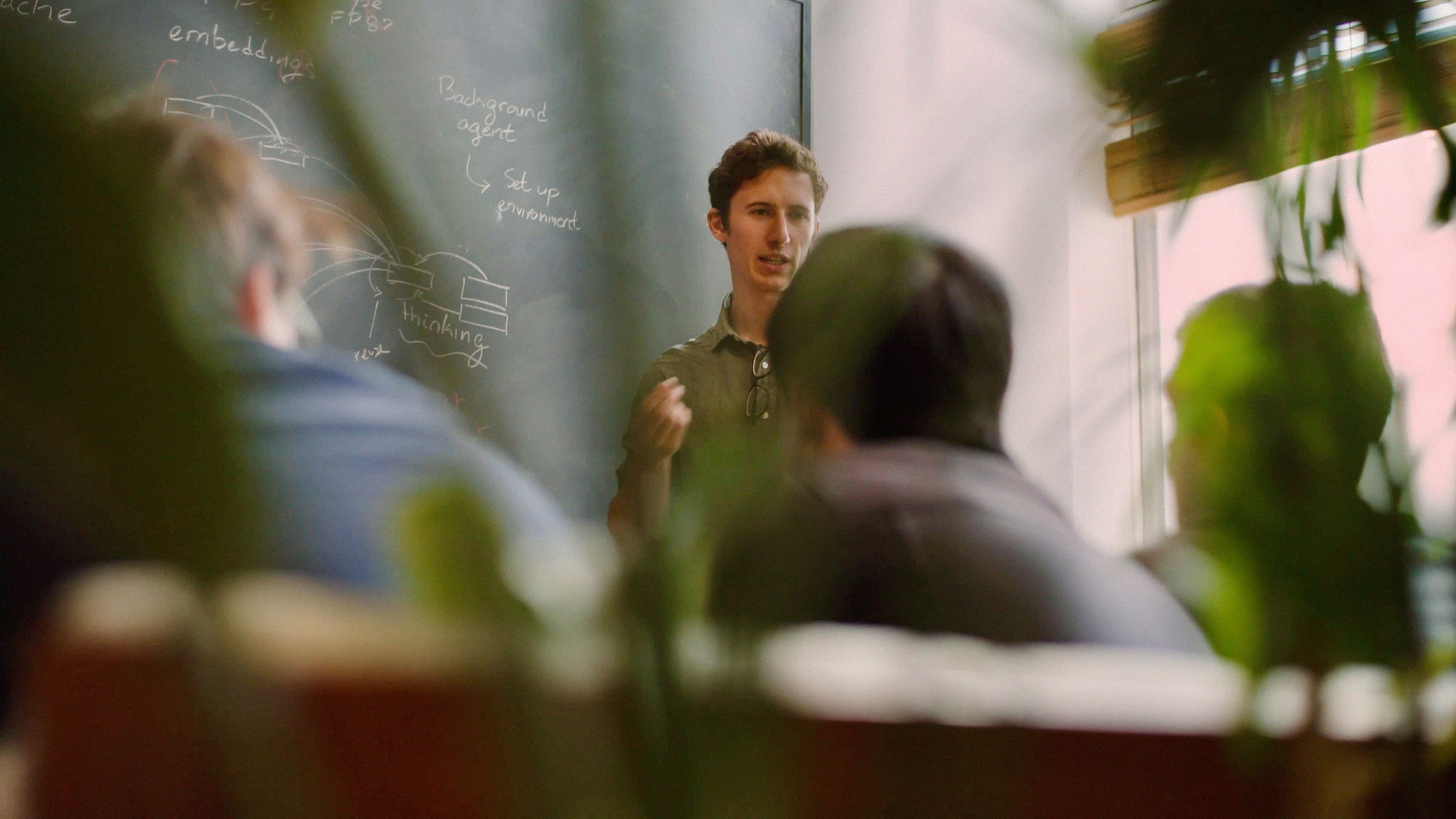 Cursor team members collaborating in an office.